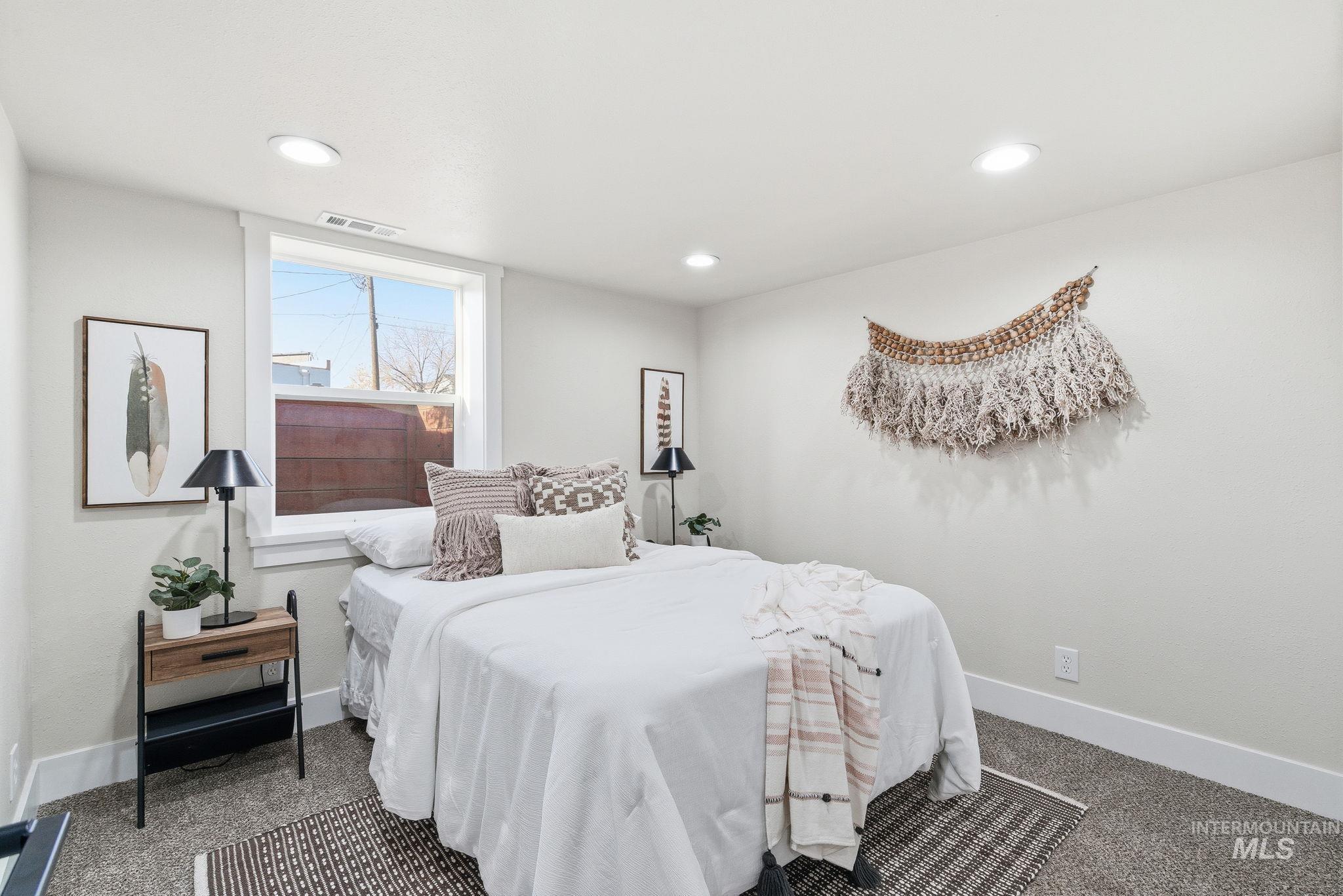 Bedroom with carpet flooring and recessed lighting