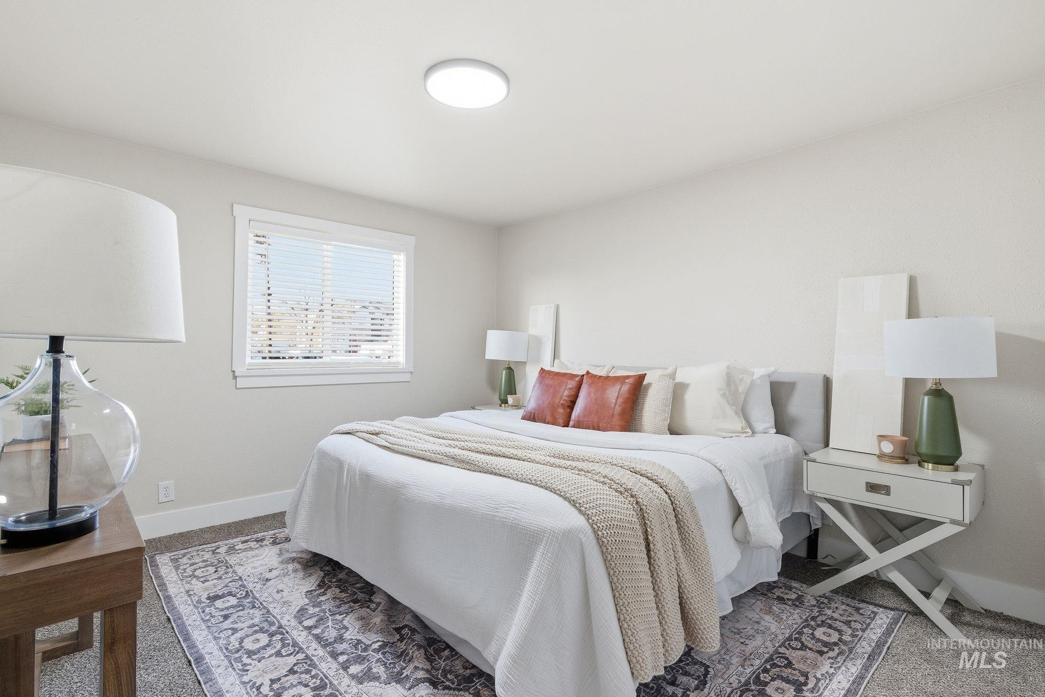 Carpeted bedroom with baseboards