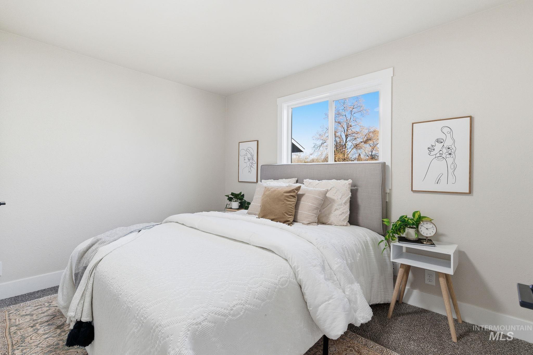 Carpeted bedroom with baseboards