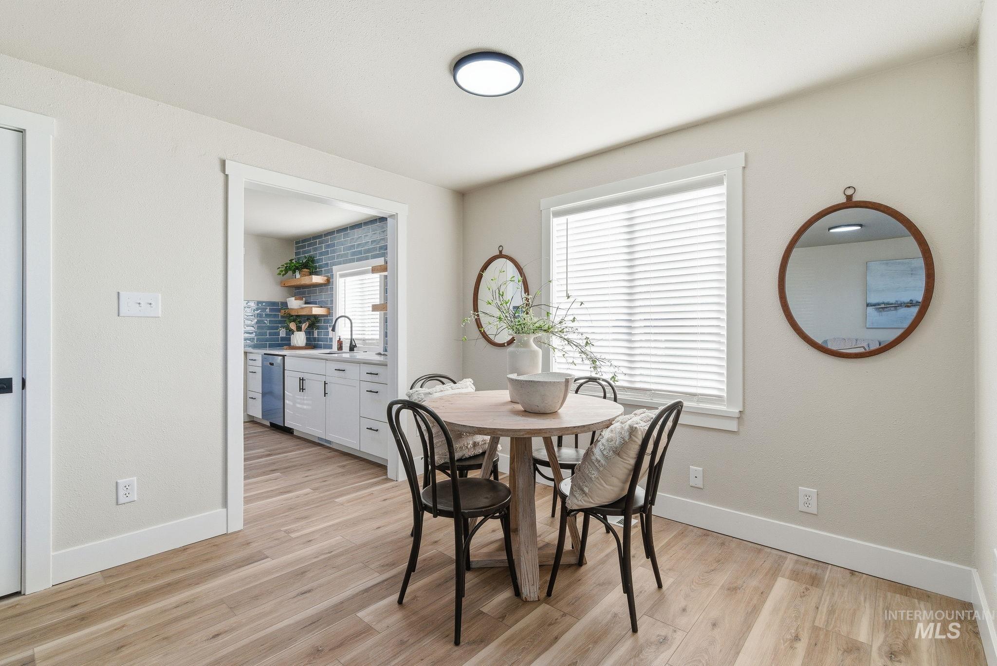 Dining space with light wood finished floors