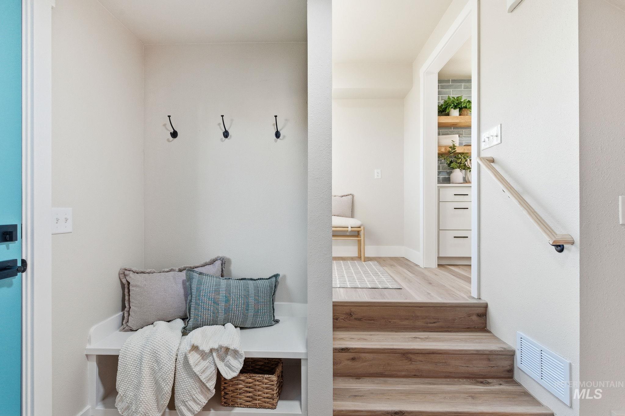 Mudroom with light wood finished floors