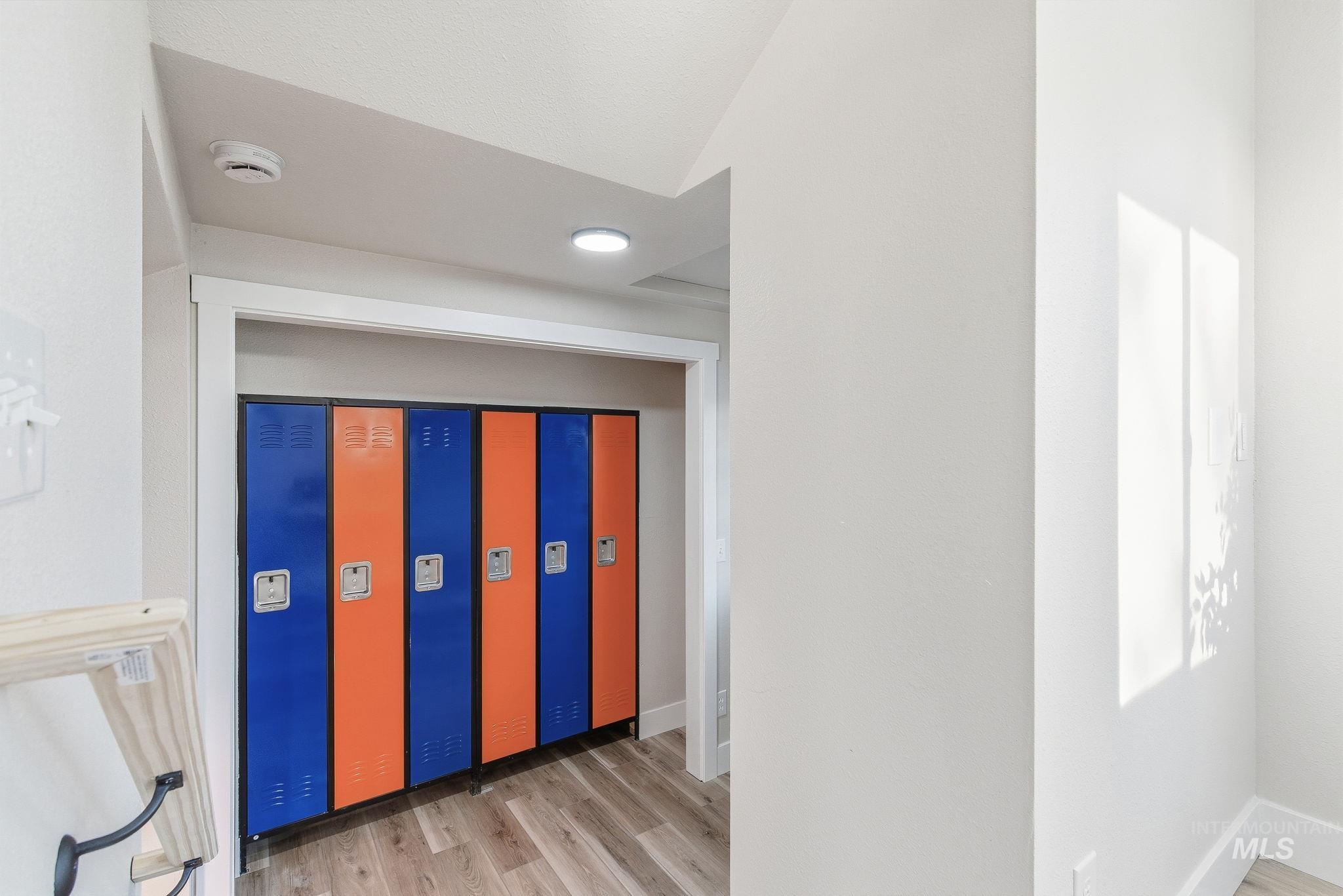 Hallway featuring light wood-style floors and recessed lighting
