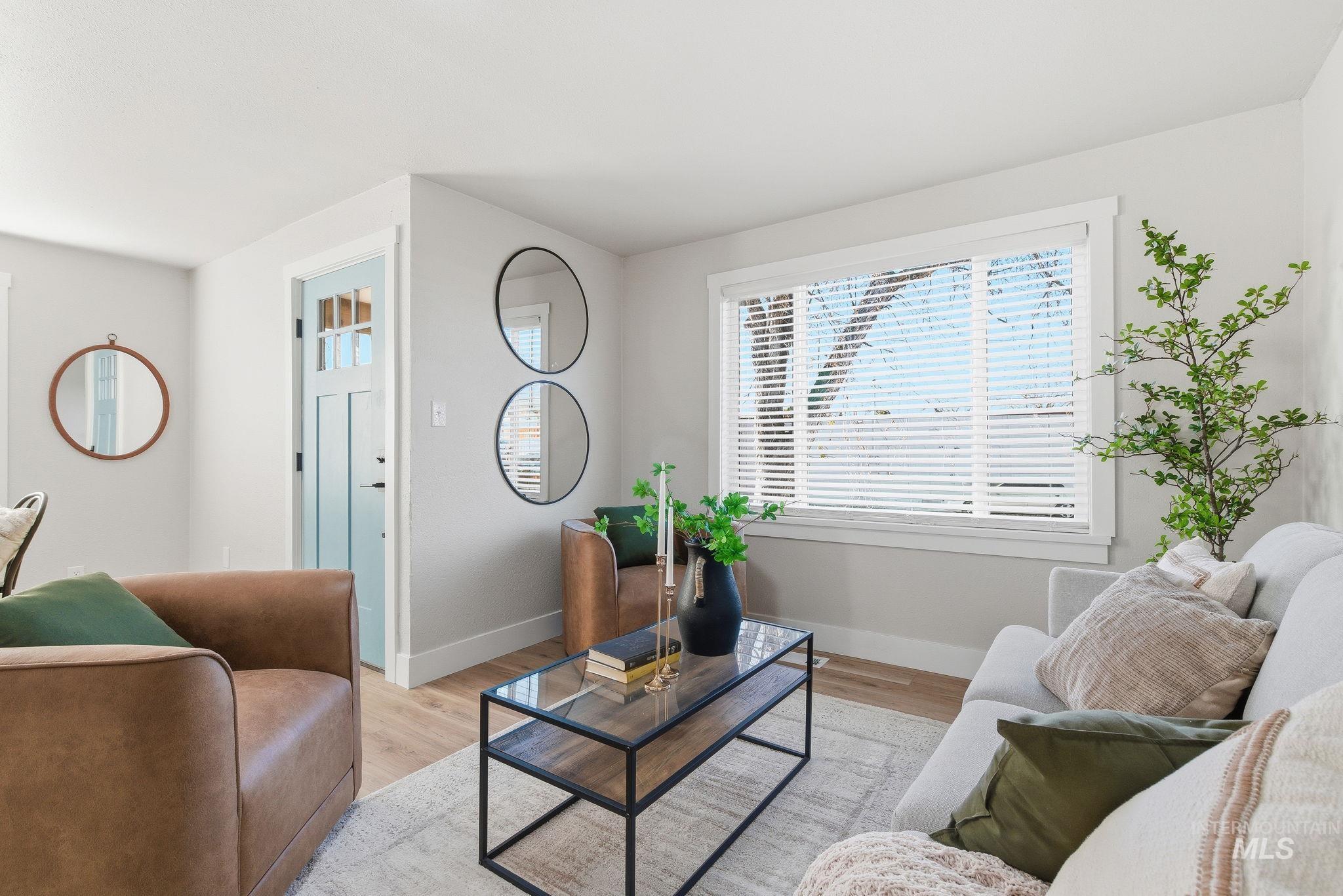 Living area featuring wood finished floors and baseboards