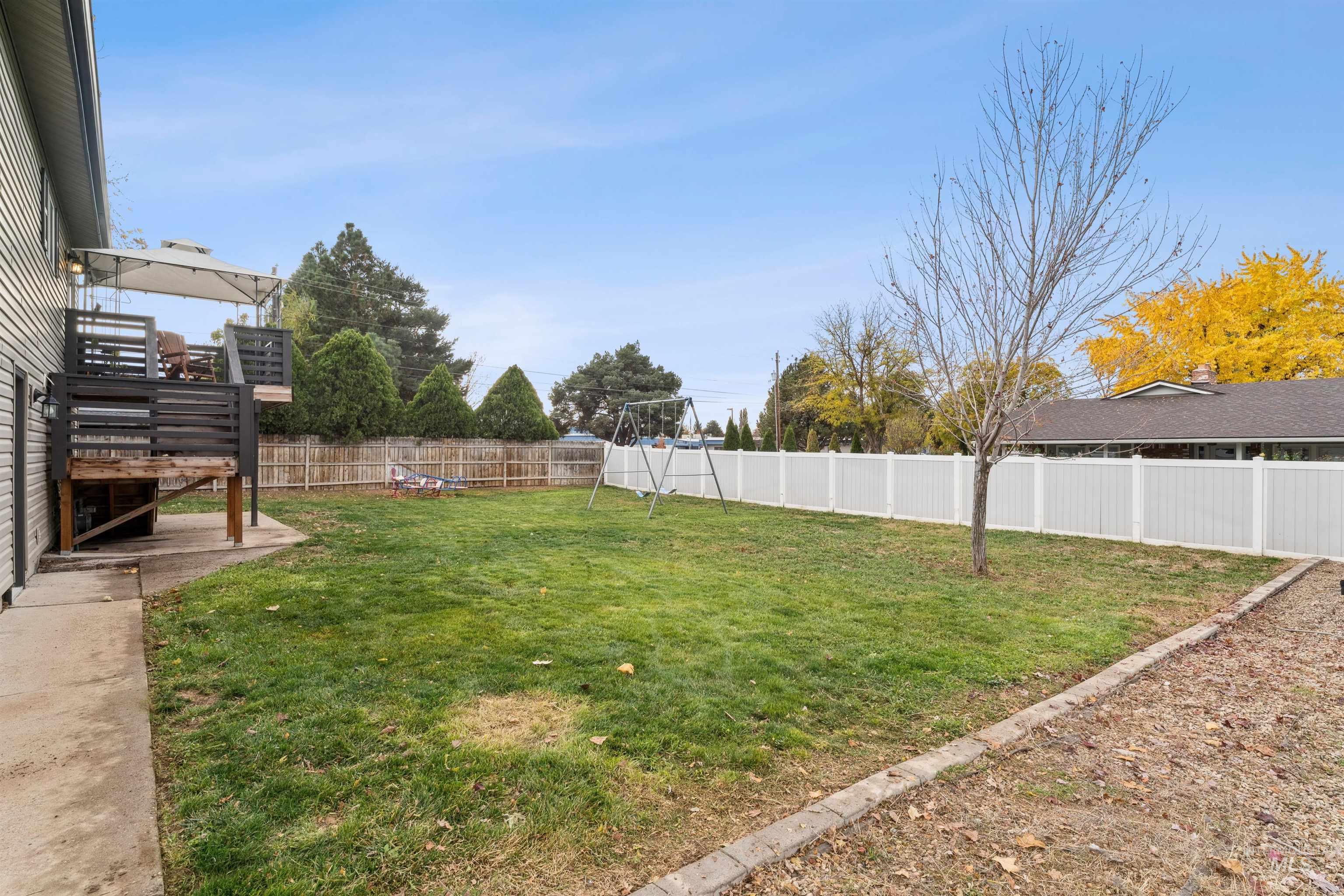 View of fenced backyard
