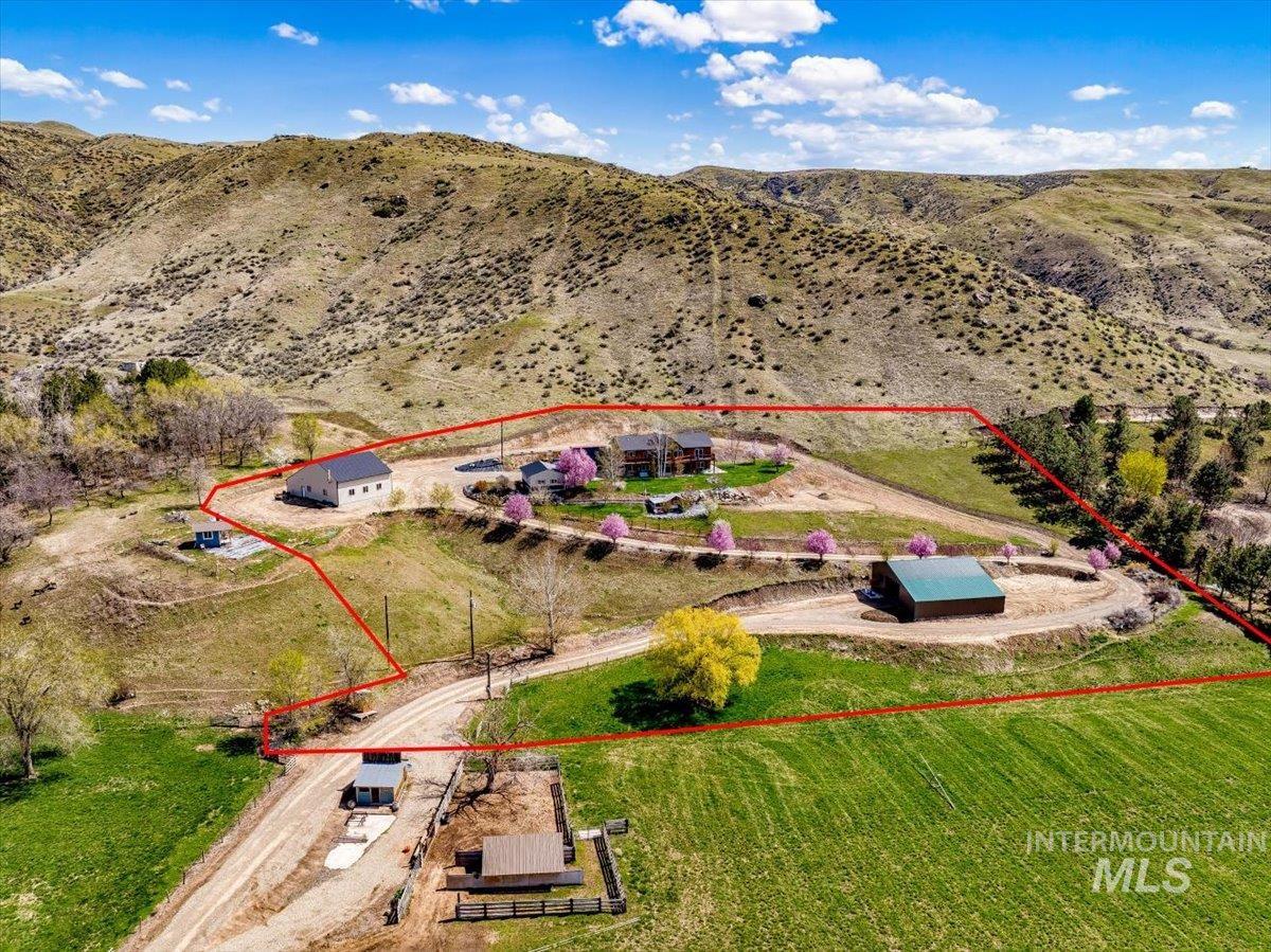 Aerial view of sparsely populated area with property boundaries highlighted