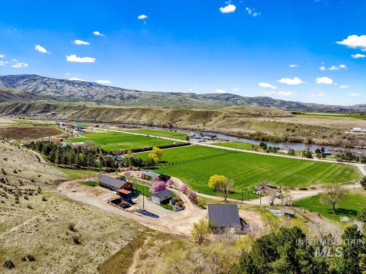 Aerial view of sparsely populated area with a mountain backdrop