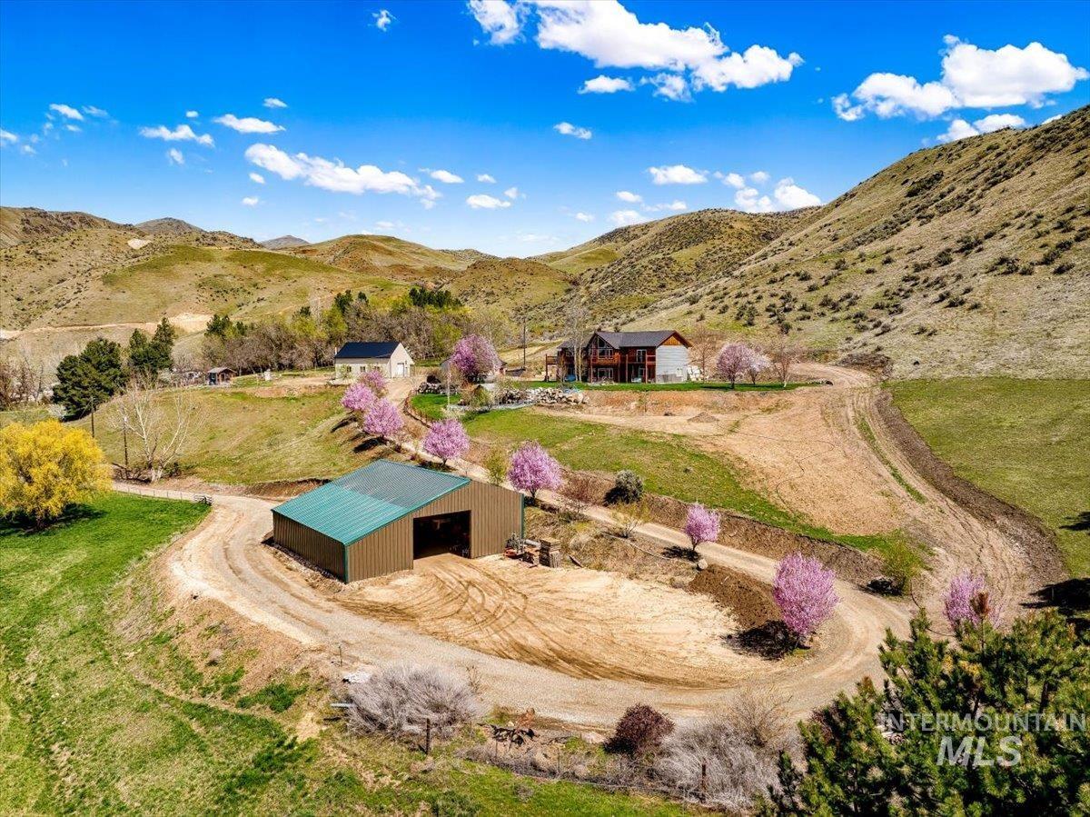 View of subject property featuring a mountainous background