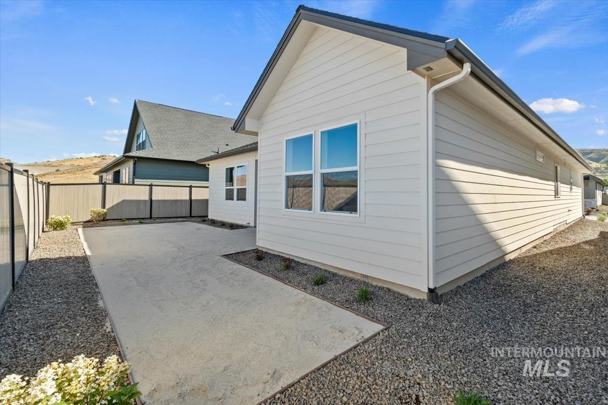 Back of property with a patio area and a fenced backyard