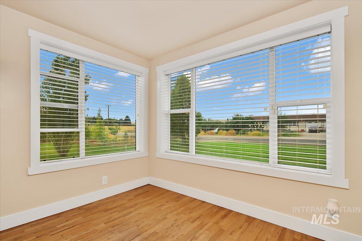 Unfurnished sunroom with healthy amount of natural light
