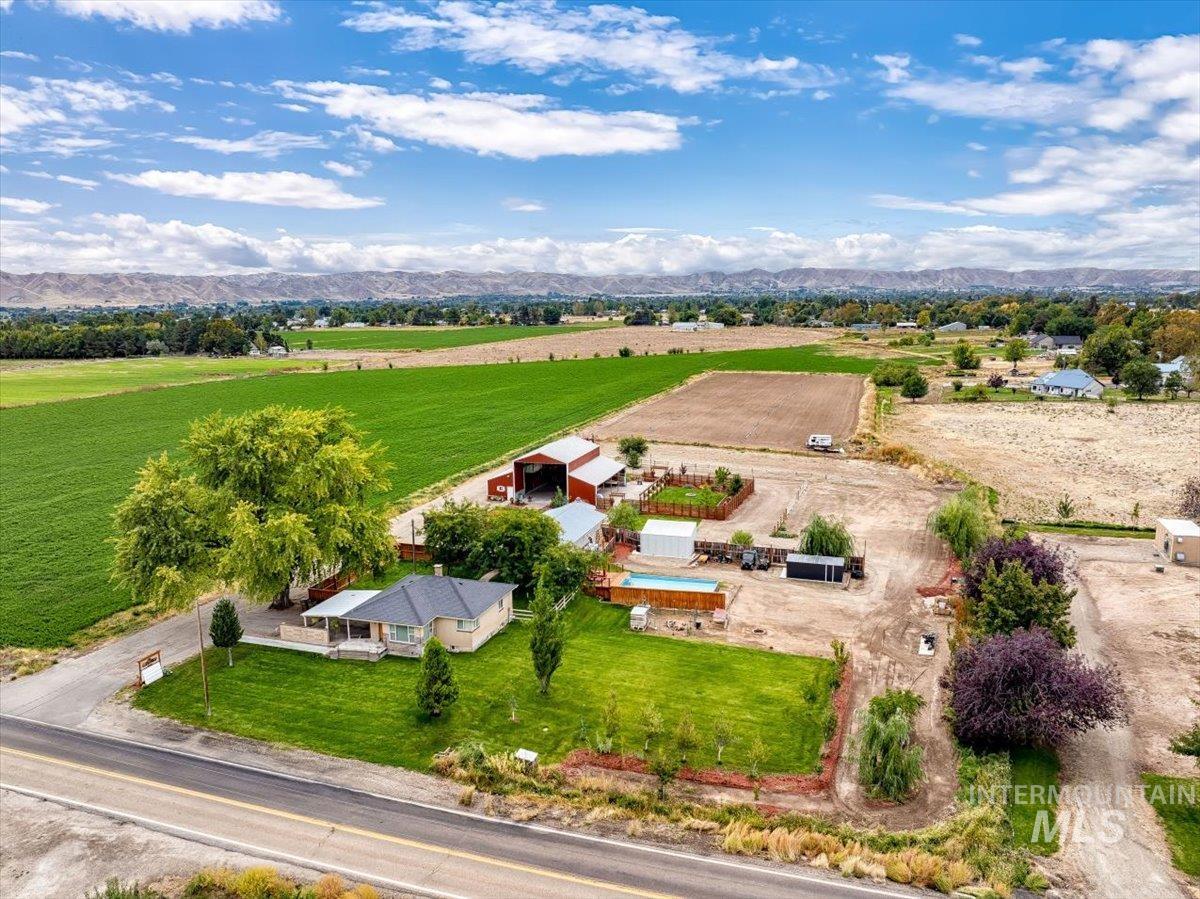 Overview of rural landscape featuring a mountainous background and abundant farmland