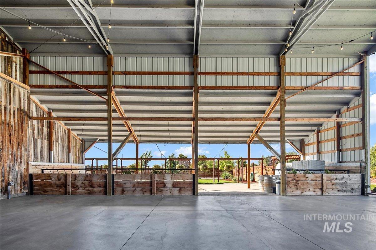 Miscellaneous room featuring concrete floors and metal wall