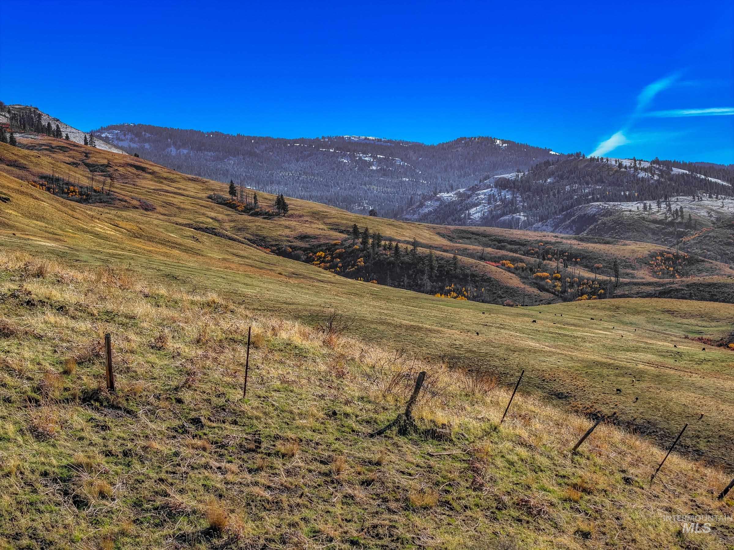 View of mountain backdrop featuring rural landscape