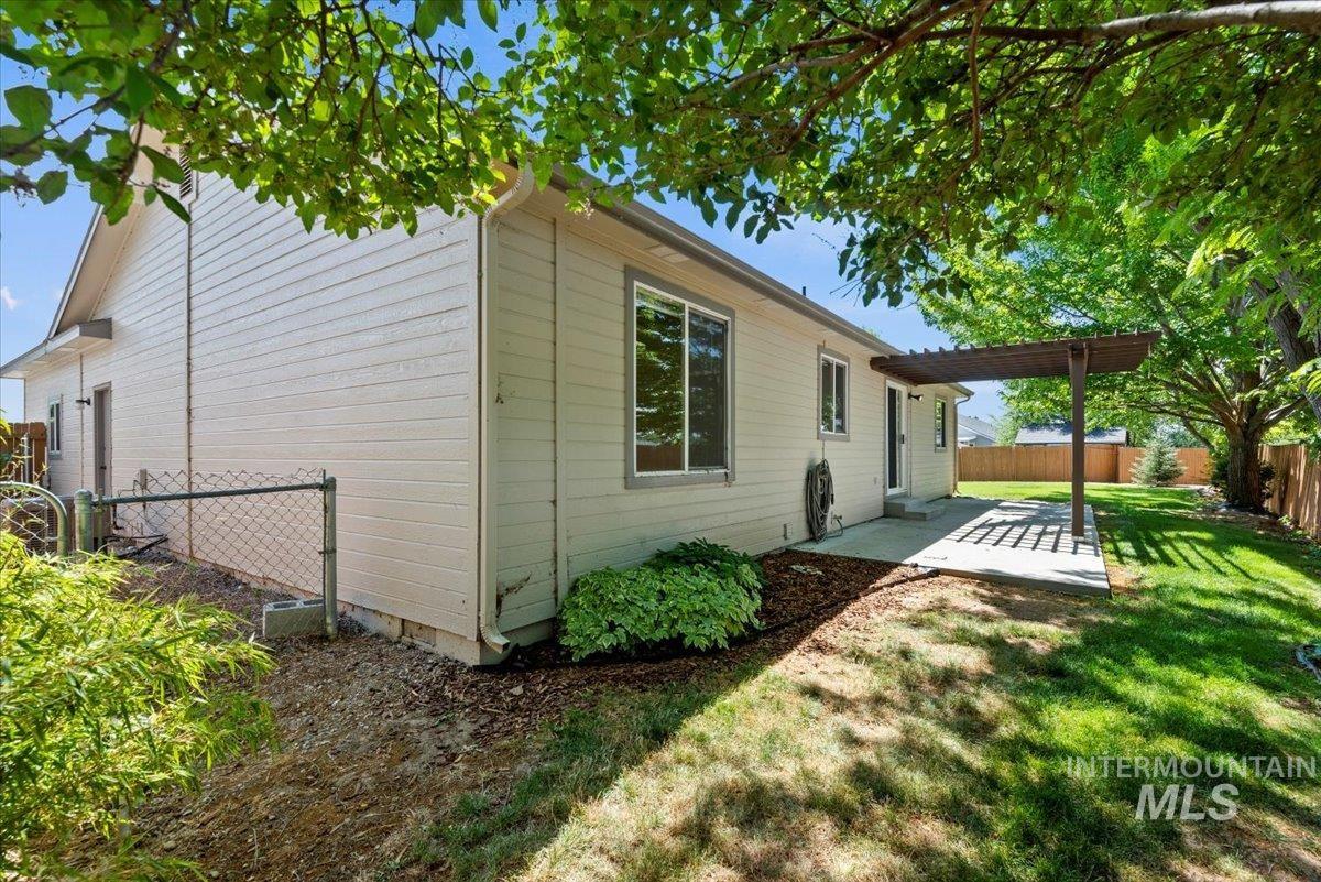 View of home's exterior featuring a patio area and a fenced backyard