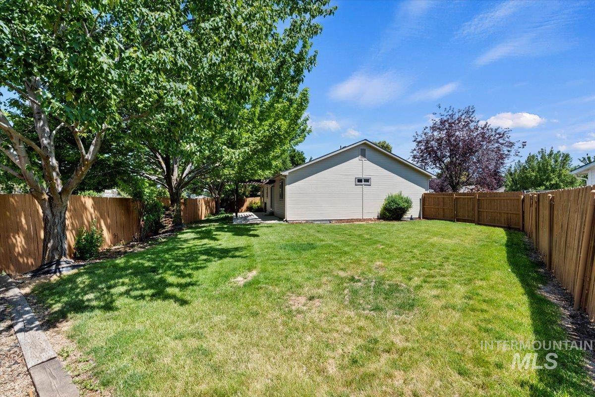 View of fenced backyard