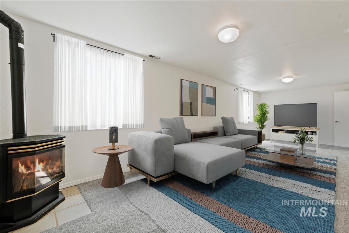 Basement Family Room with a wood stove