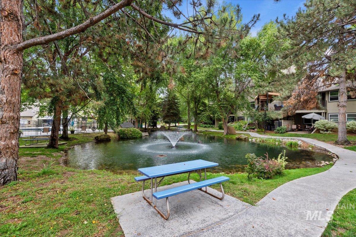 View of community featuring a water view