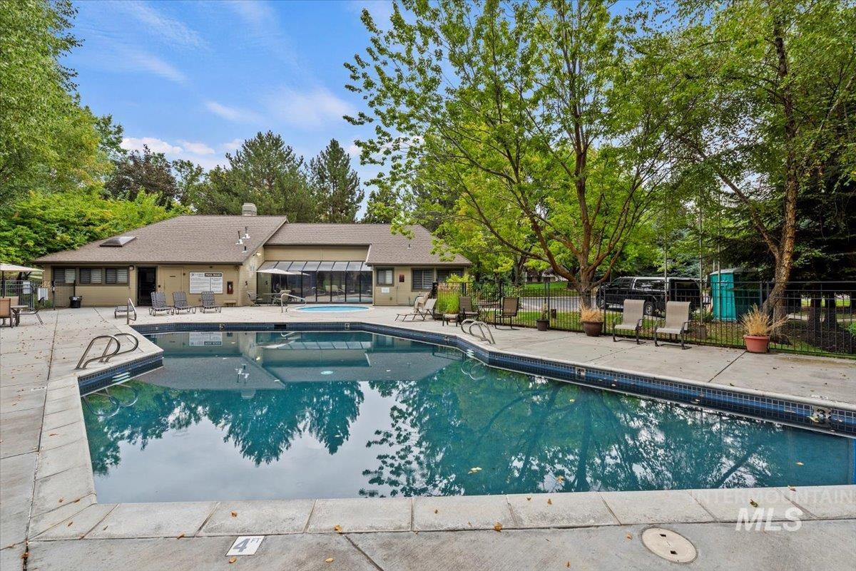Community pool featuring a patio