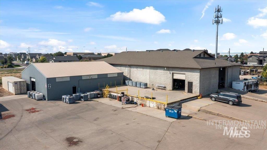 View of property with a residential view