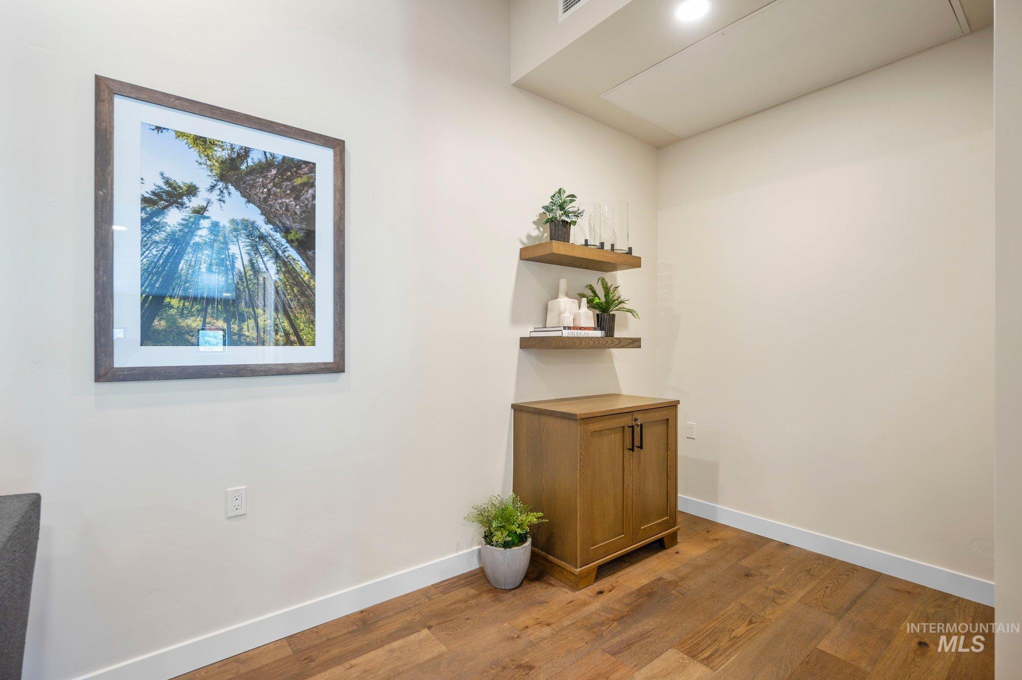 Detailed view of wood finished floors and baseboards
