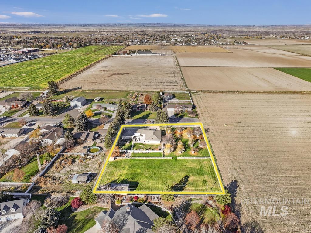 View of rural area with property boundaries highlighted and rows of crops