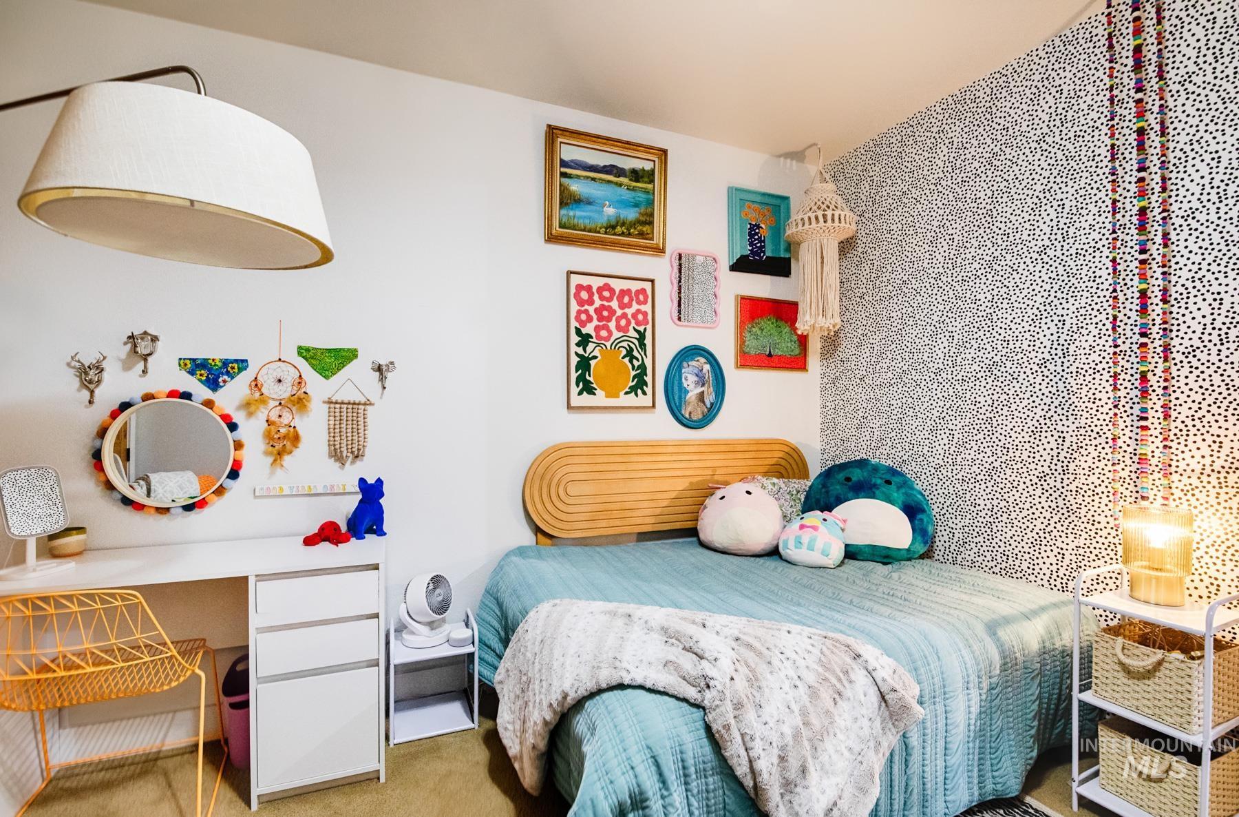 Carpeted bedroom featuring a desk