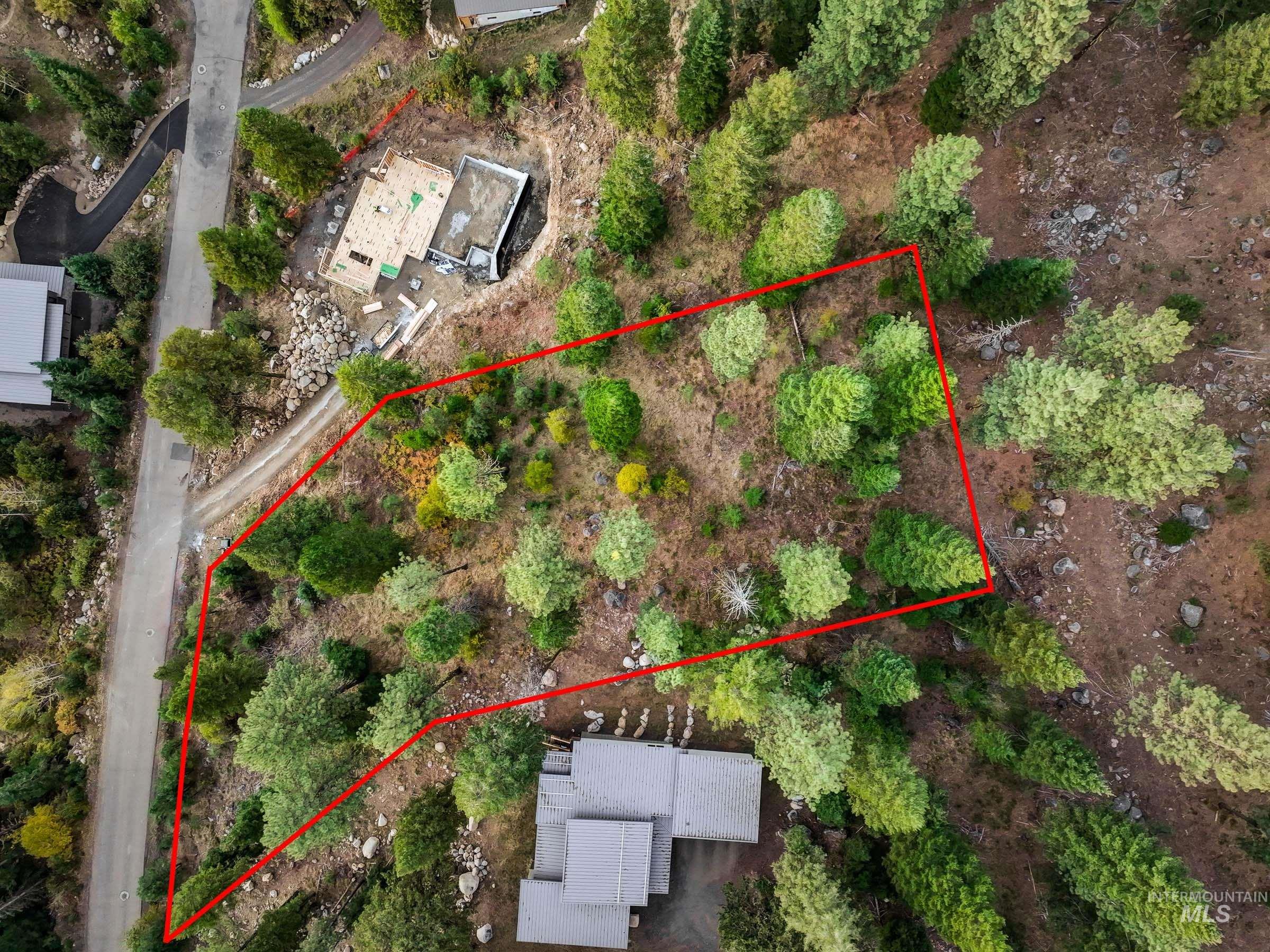 Aerial view of property and surrounding area with property boundaries highlighted