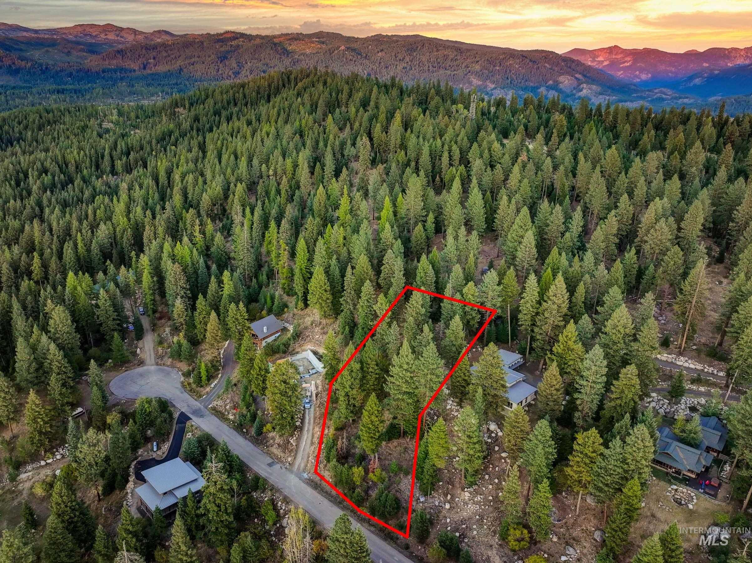 View of property location with a mountain backdrop and property boundaries highlighted