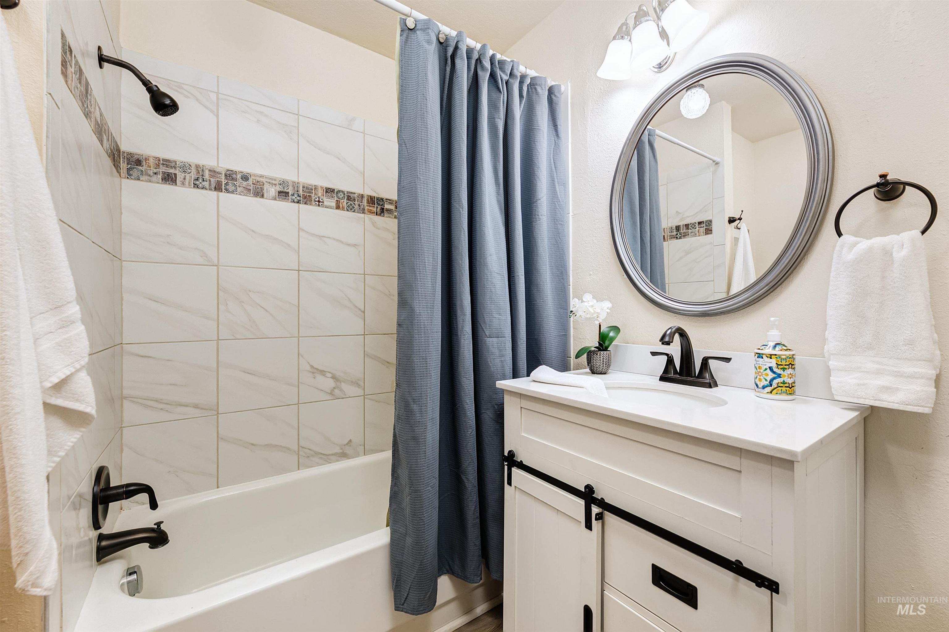 Bathroom with shower / tub combo.