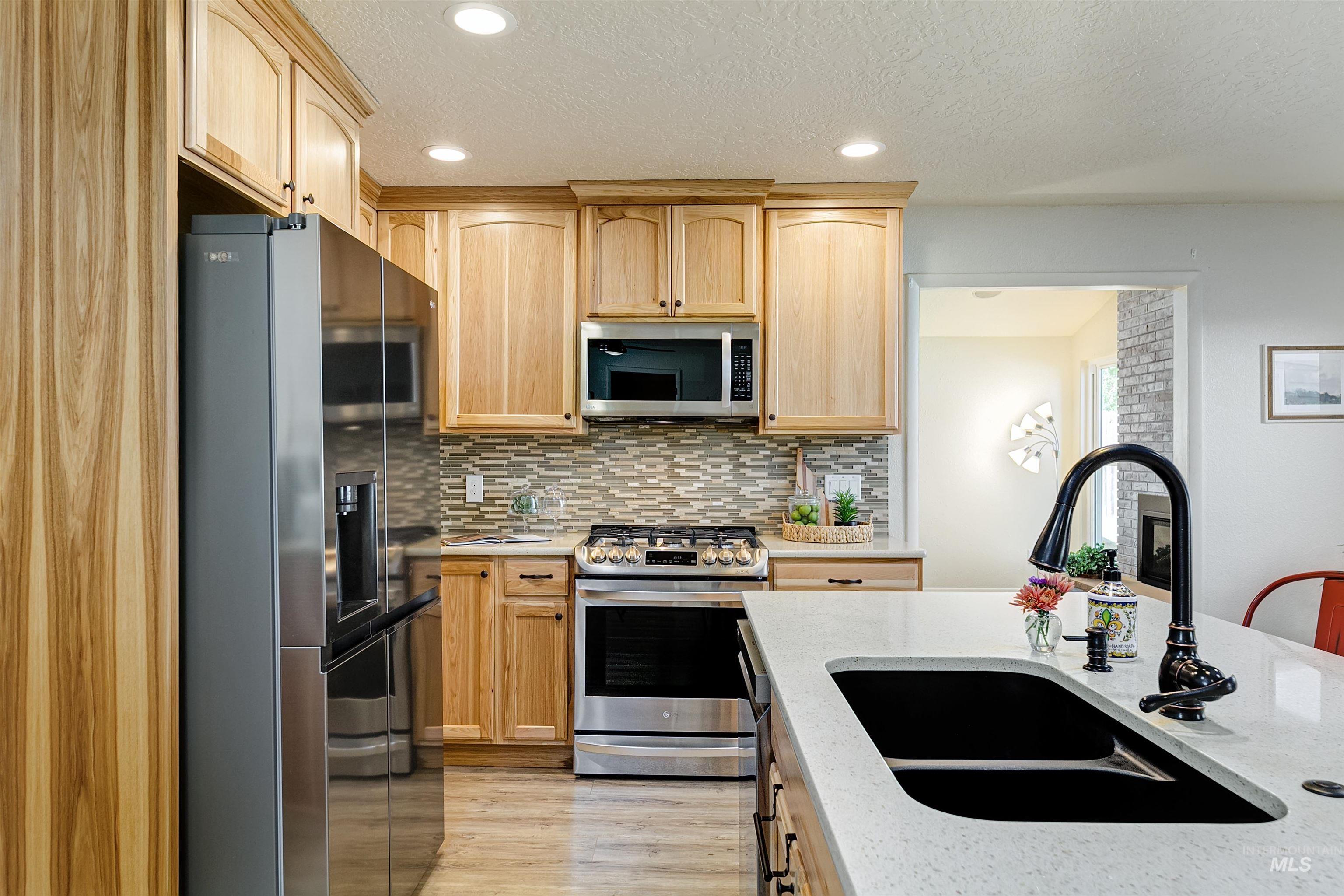 Spacious kitchen with quartz countertops.