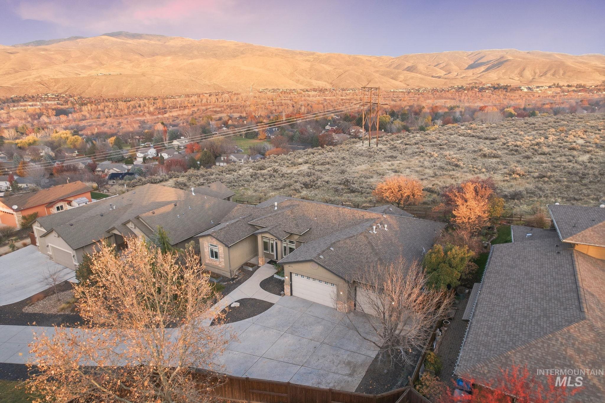 Aerial perspective of suburban area with a mountain backdrop