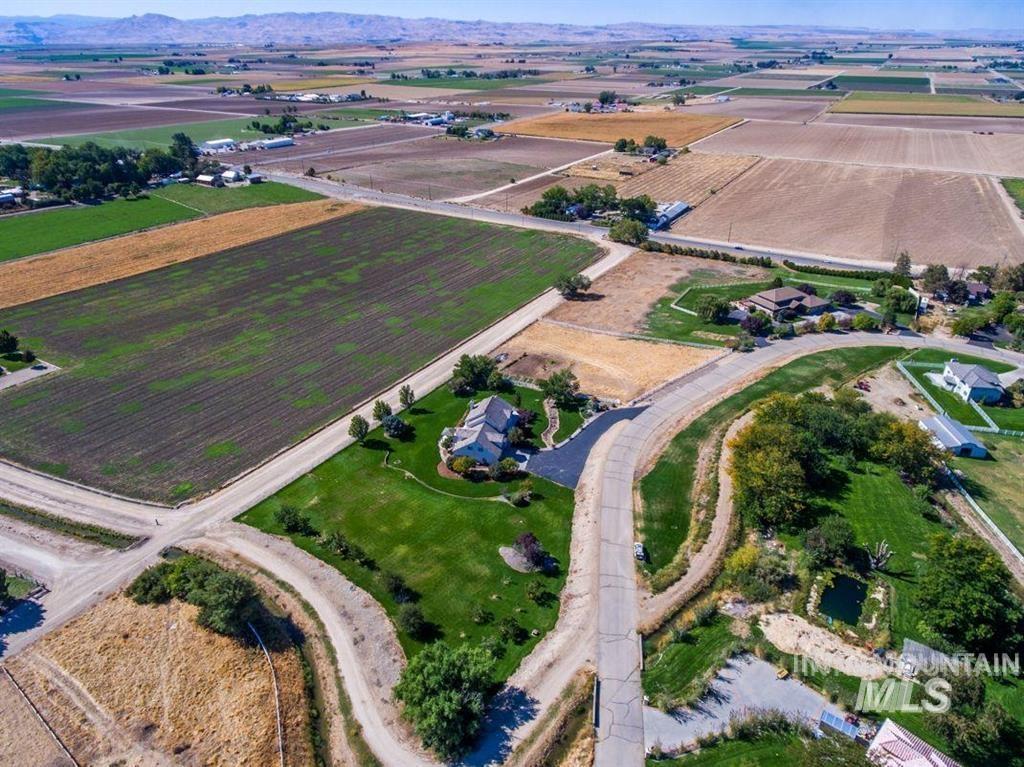 Aerial overview of property's location with rural landscape and farmland