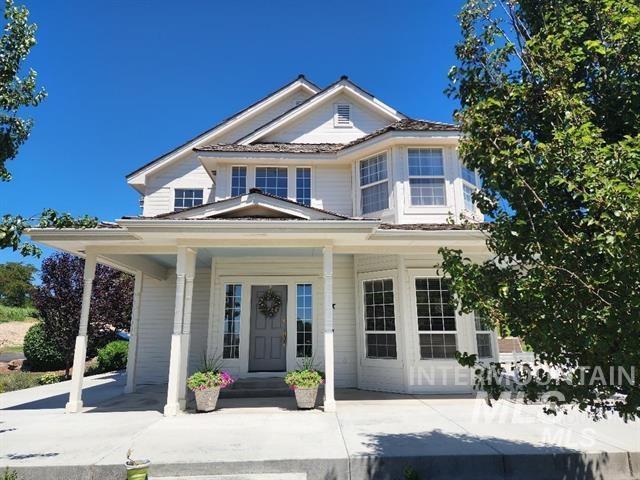 View of front of house with covered porch