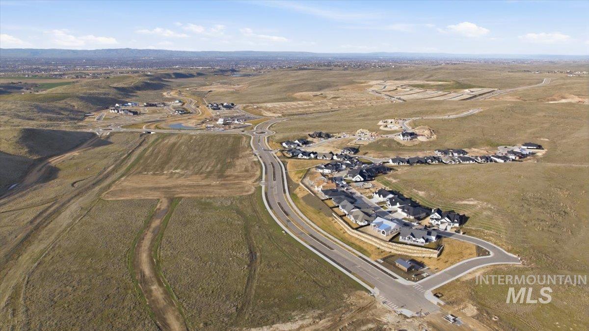 Aerial view of property and surrounding area featuring rural landscape