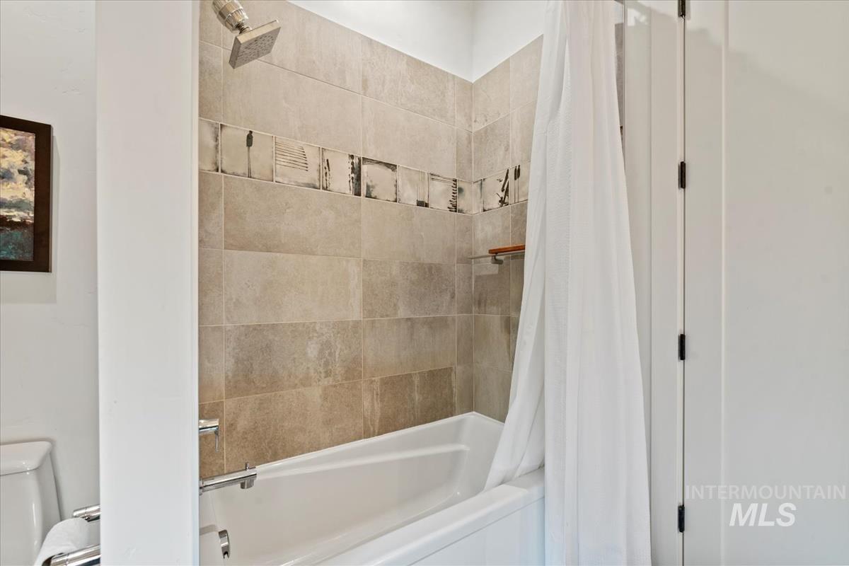 Full bathroom with shower / bath combo