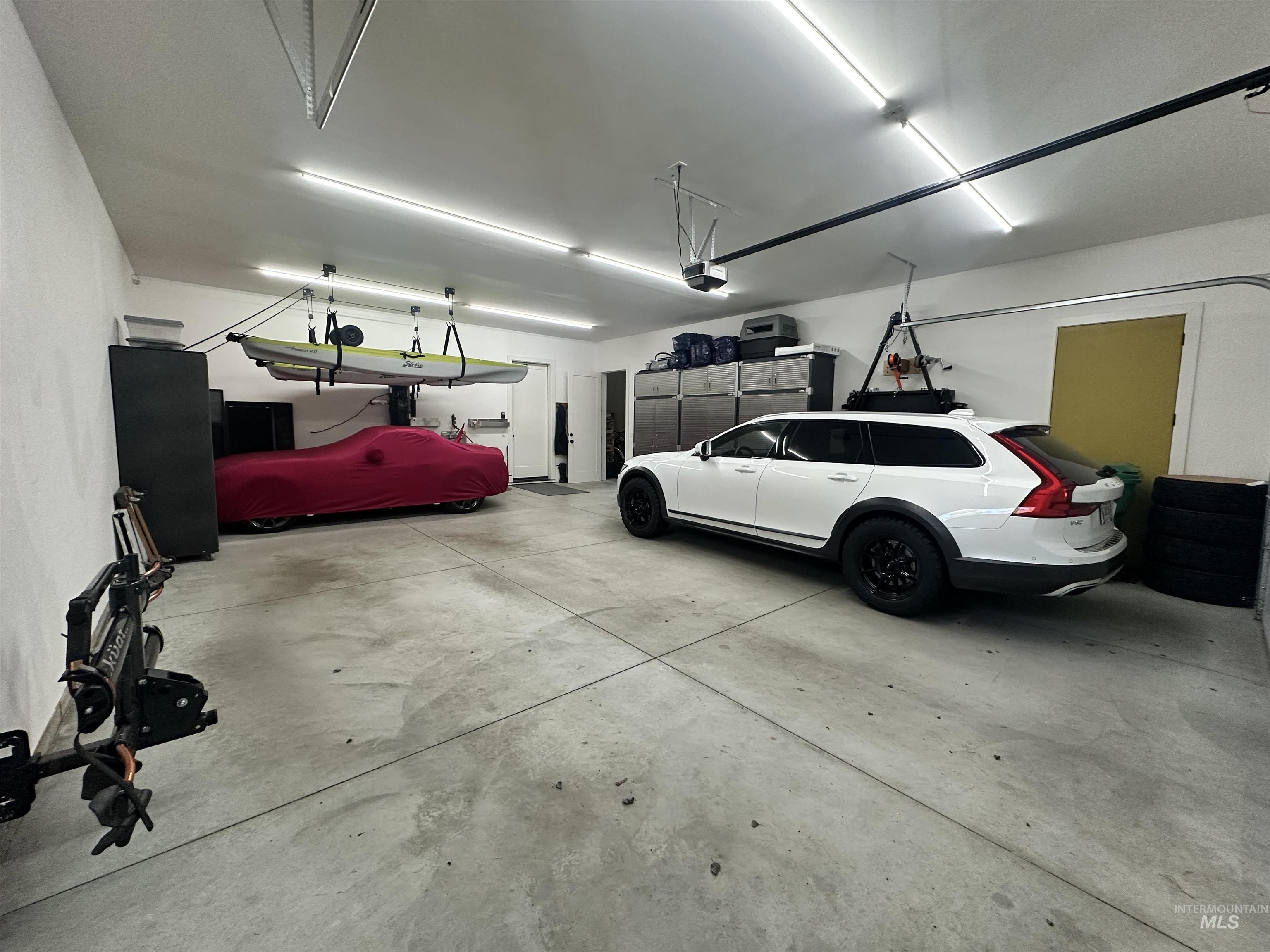 Huge garage - Check out the 3rd car parked sideways to visually showcase how much room you have and all the different storage options that are available.
