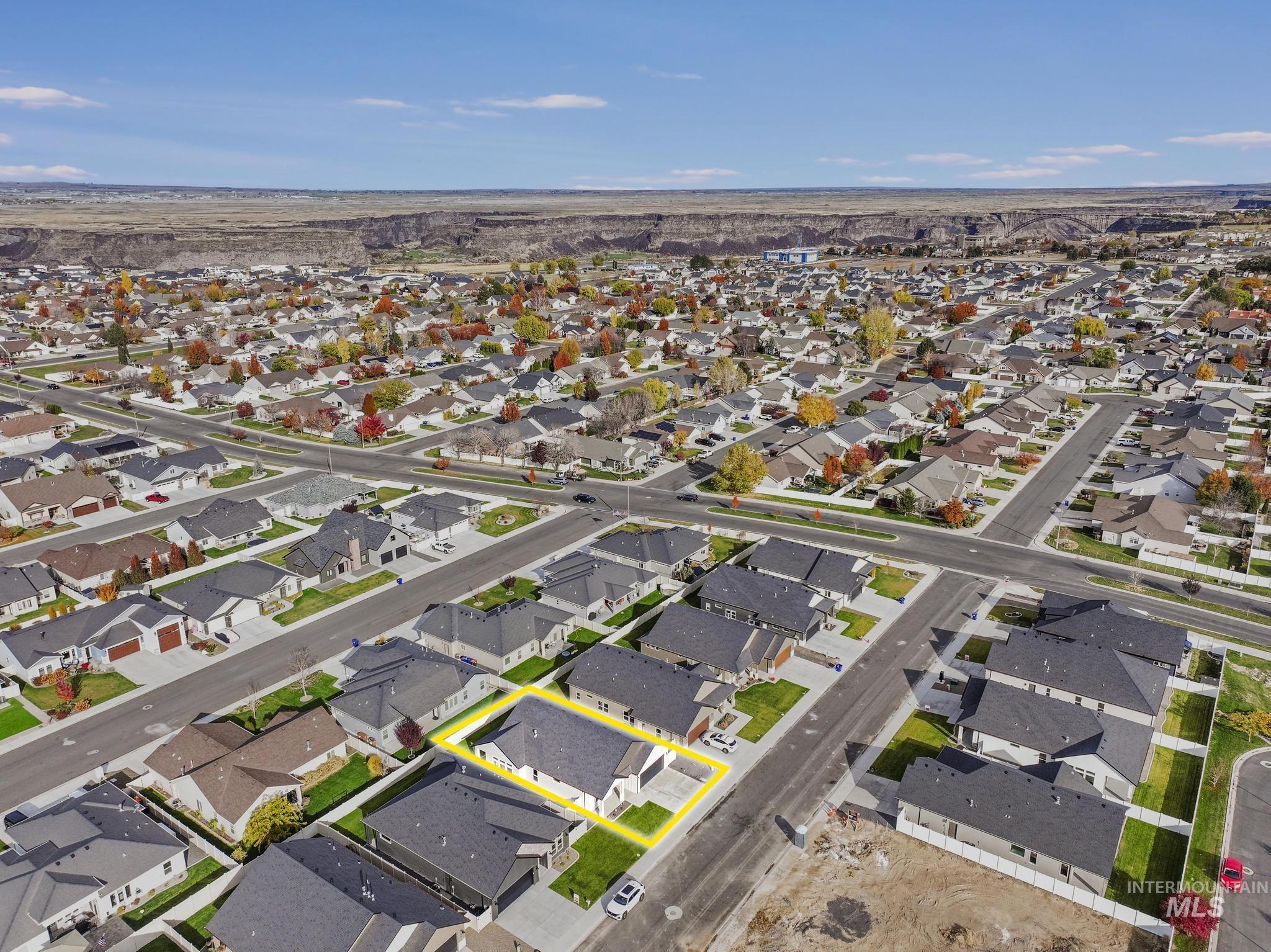 Aerial view of property's location featuring nearby suburban area