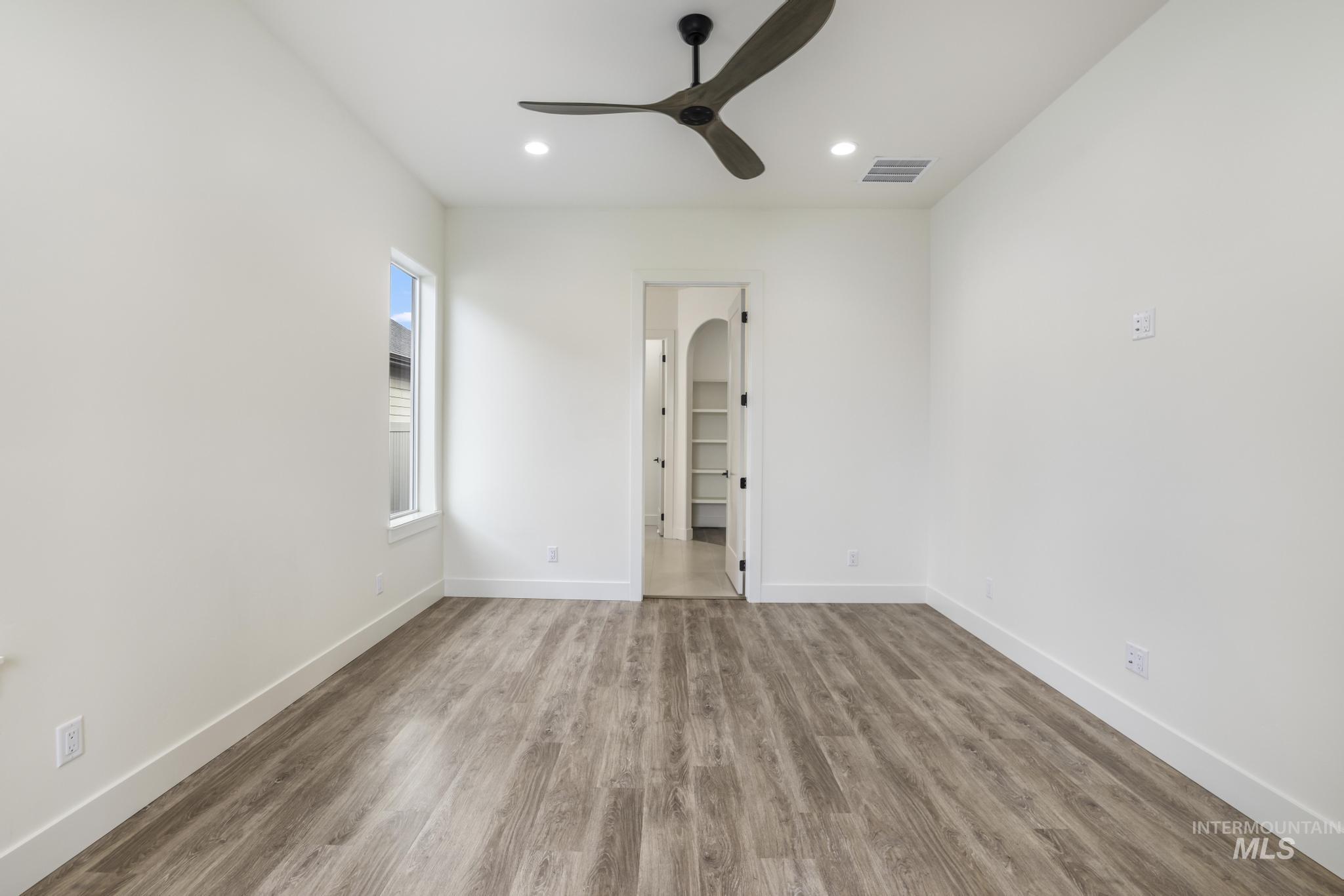 Unfurnished room featuring wood finished floors, recessed lighting, and ceiling fan