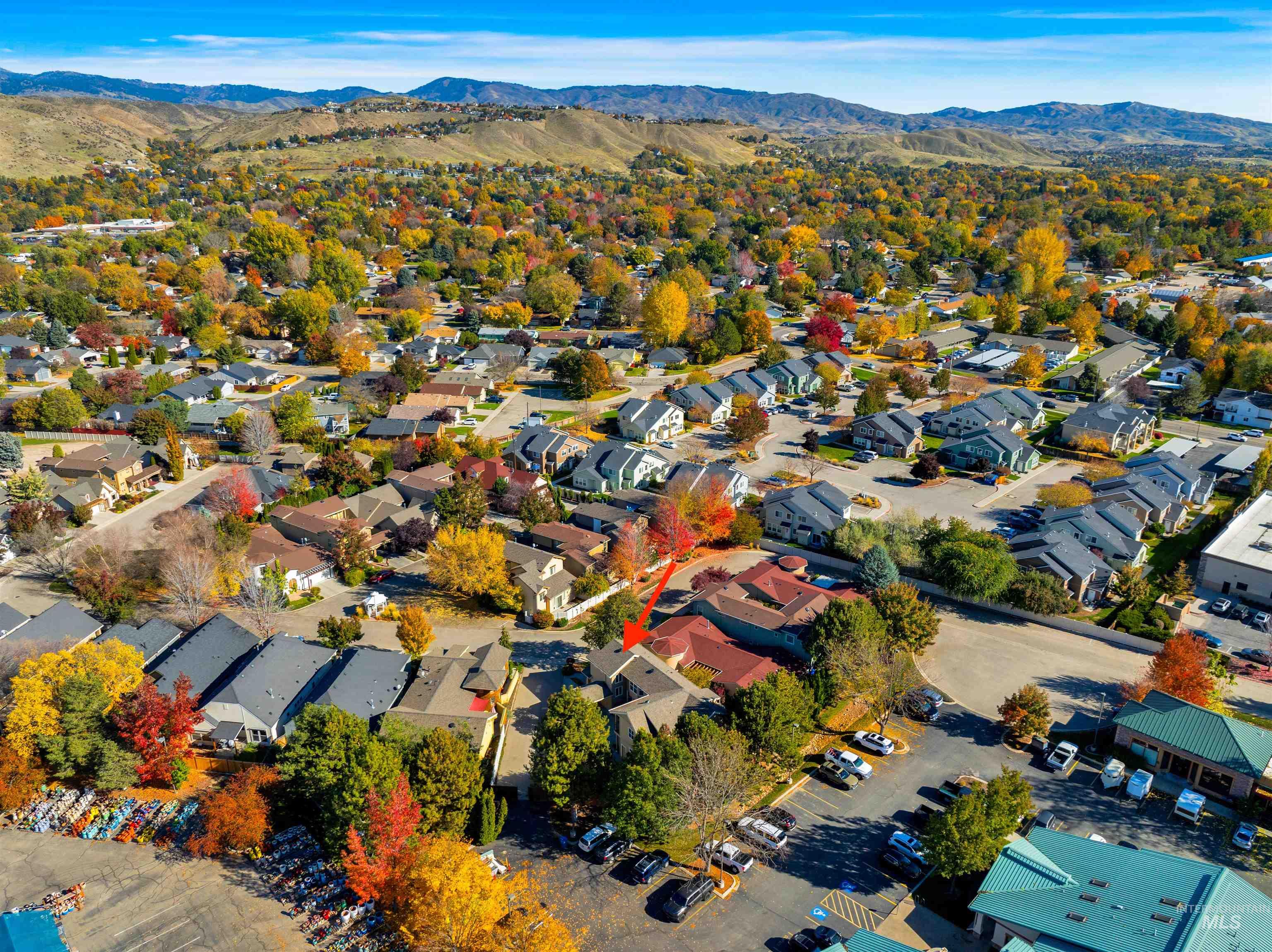 Aerial view of residential area with a mountainous background