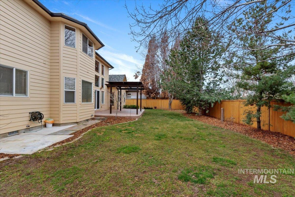 Fenced backyard featuring a patio area