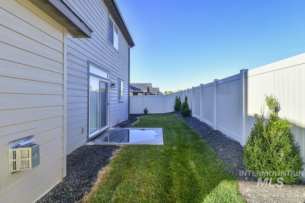 Fenced backyard featuring a patio