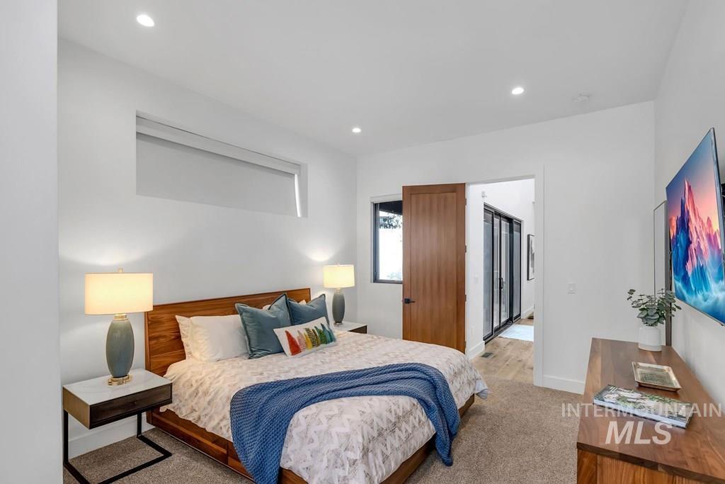 Bedroom featuring recessed lighting and wood finished floors