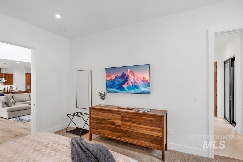 Bedroom featuring recessed lighting and light carpet