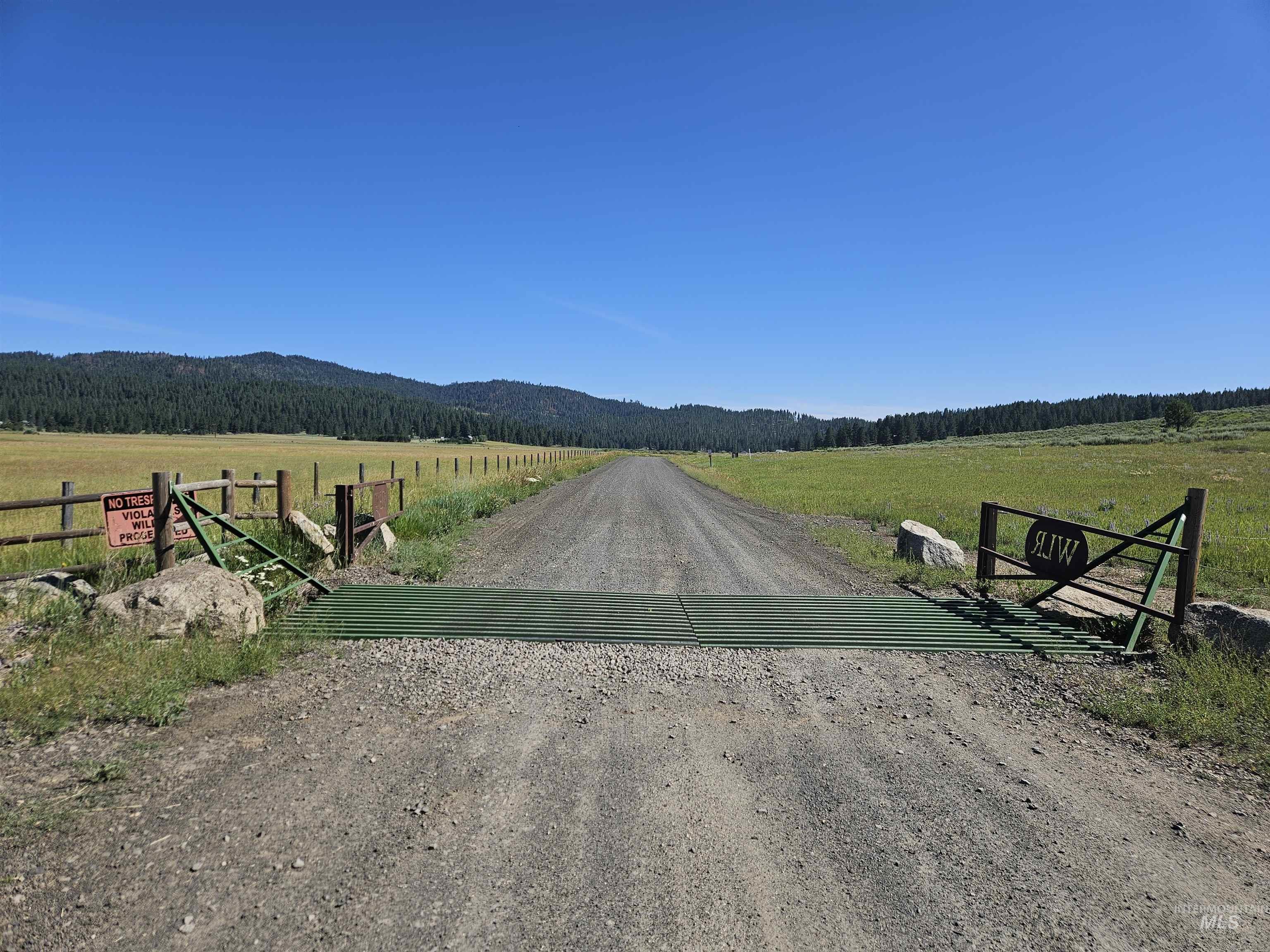 View of dirt / gravel road with a view of countryside