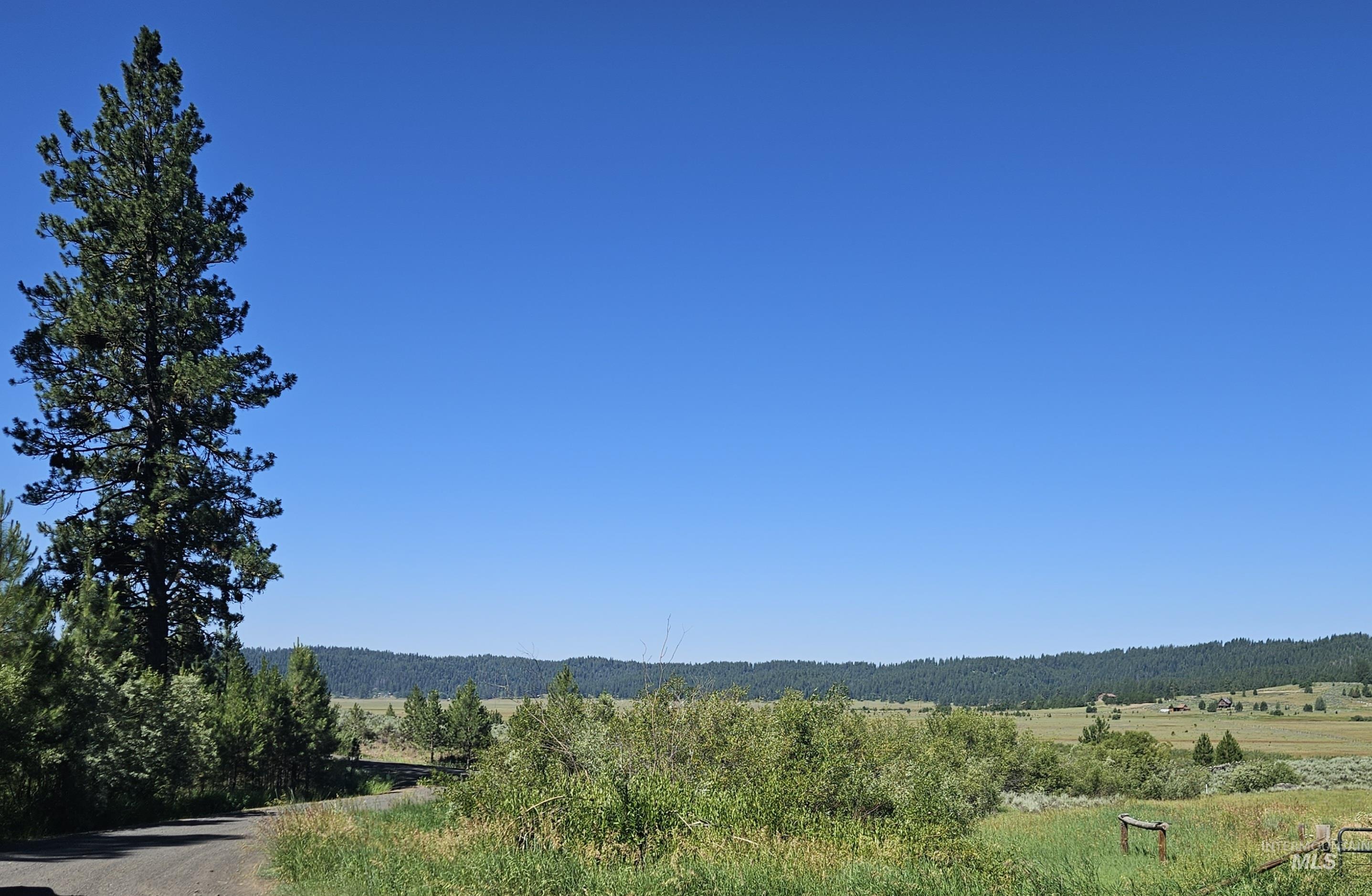 View of mountain backdrop featuring rural landscape
