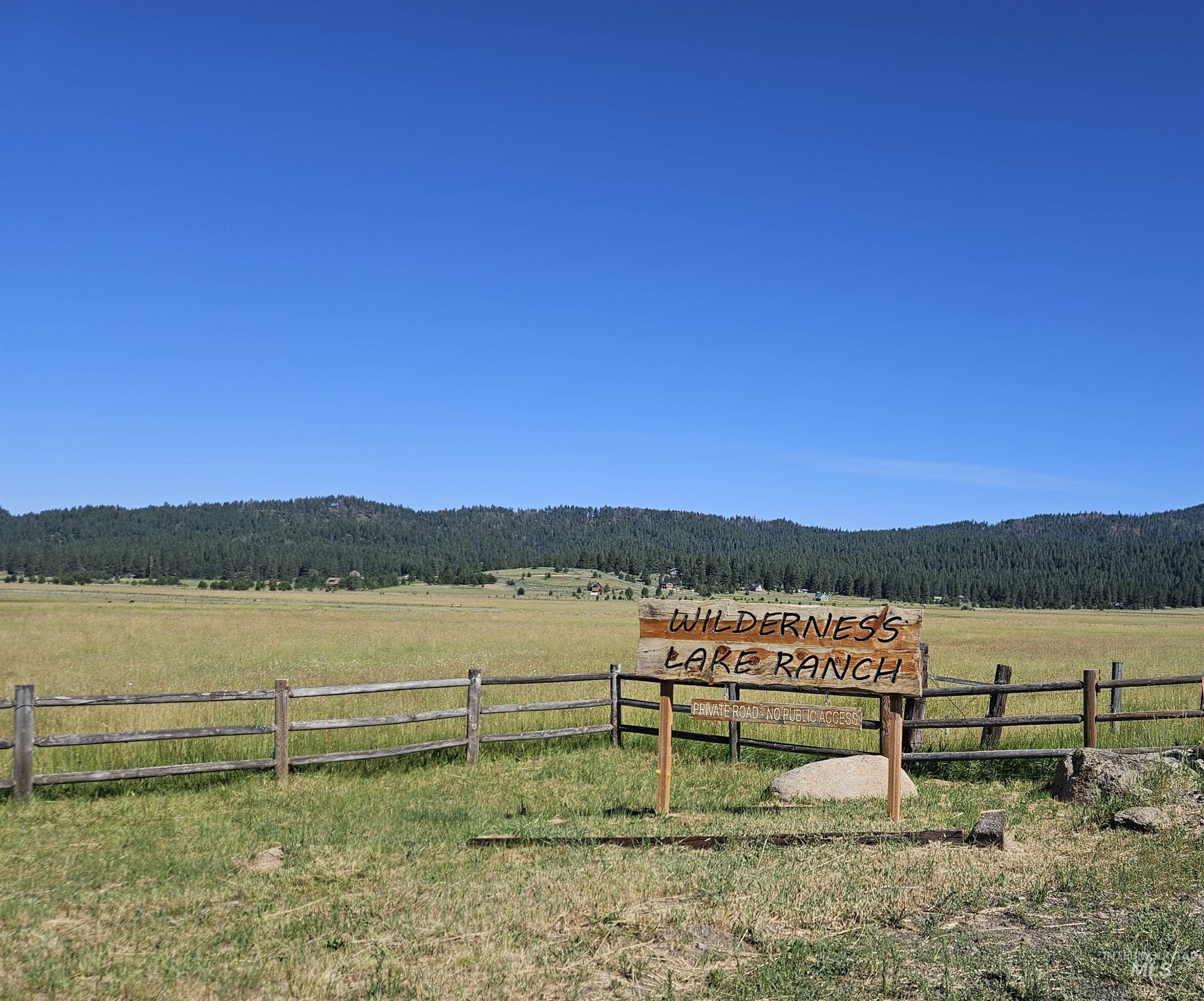 View of mountain backdrop with rural landscape