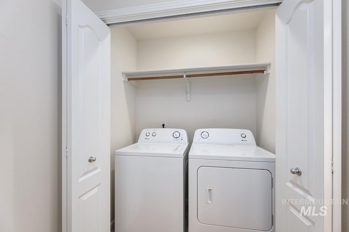 Laundry area featuring separate washer and dryer