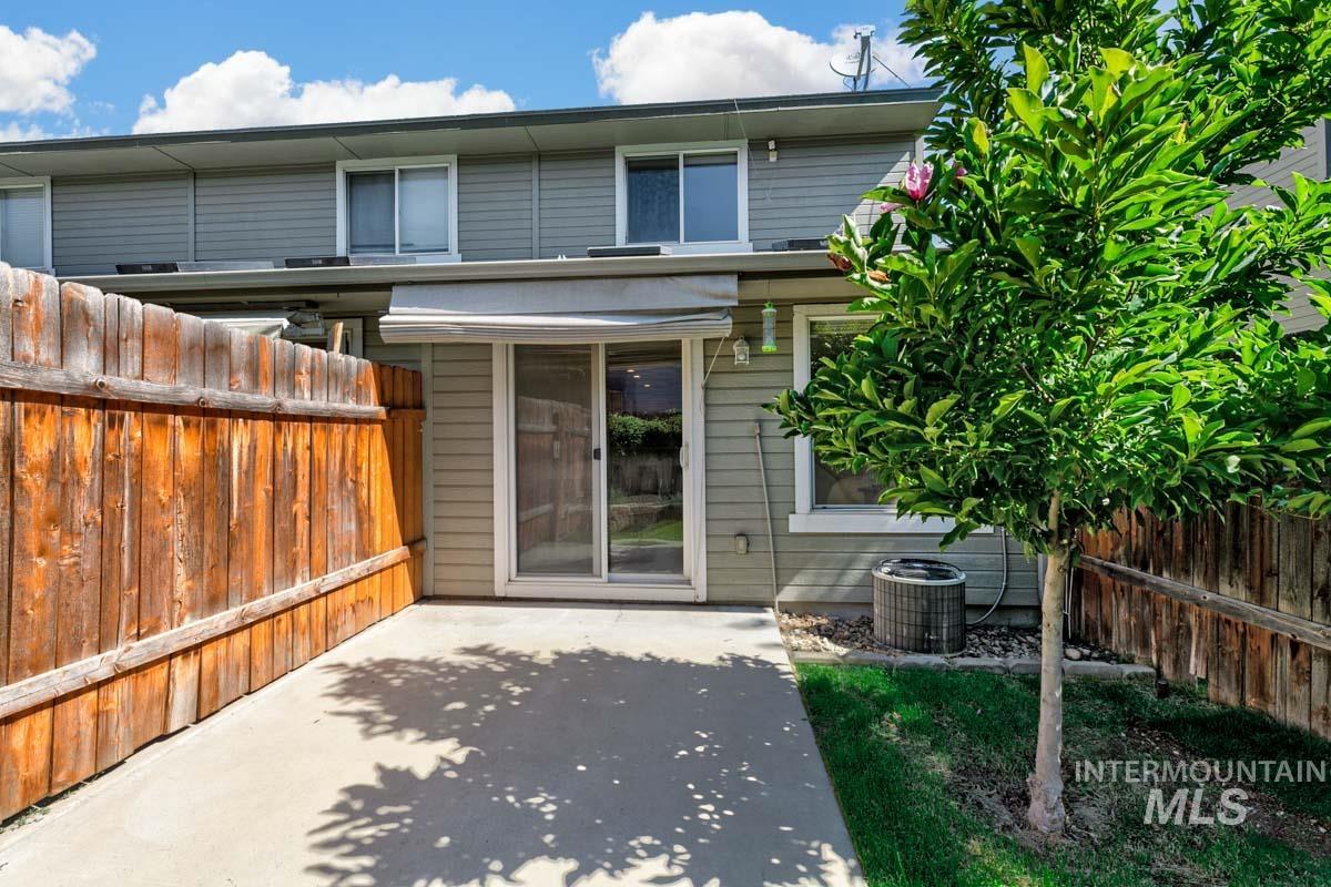 Rear view of property featuring a patio area