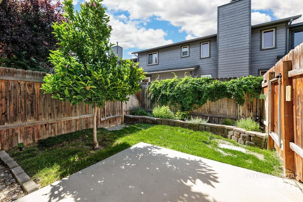 Fenced backyard featuring a patio