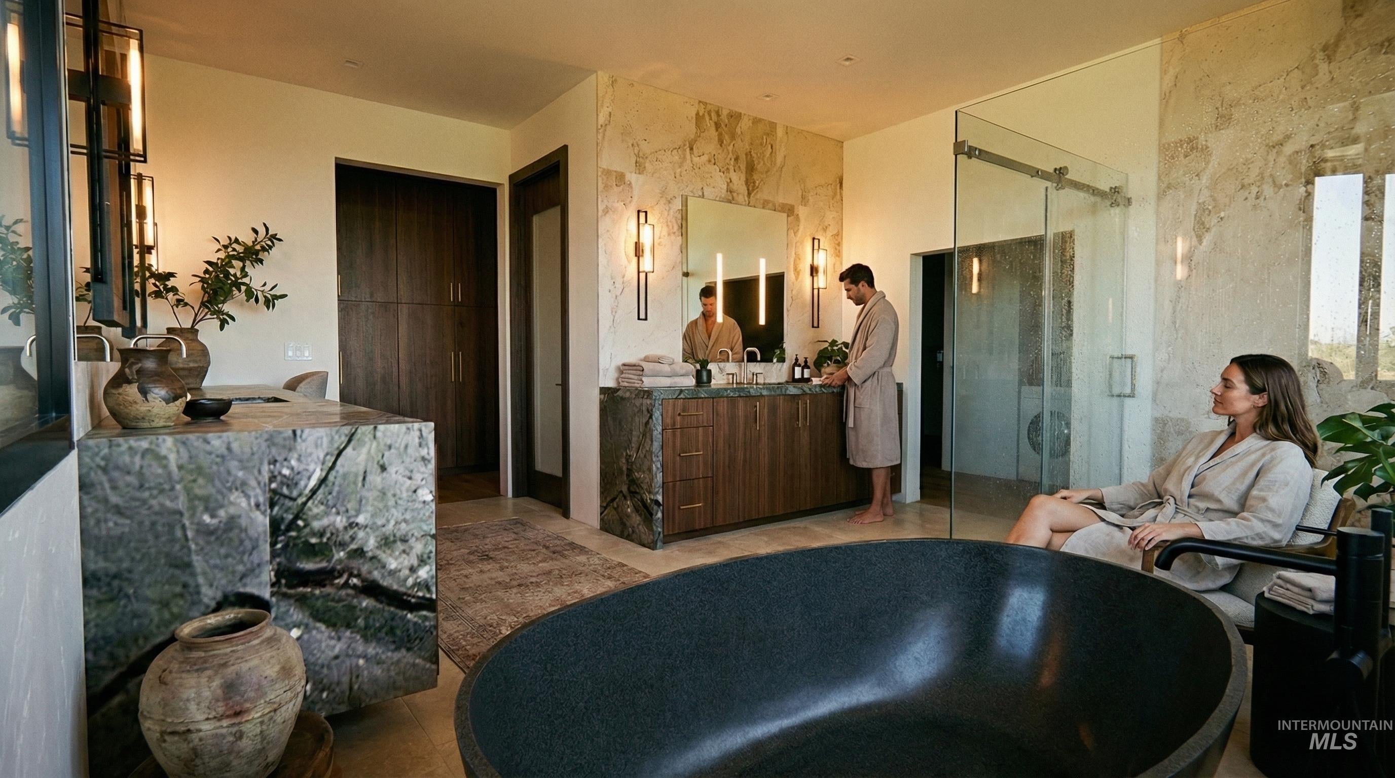 Spacious bathroom featuring a freestanding soaking tub, stone accent wall, double vanity with wood cabinetry, glass-enclosed shower, and built-in storage