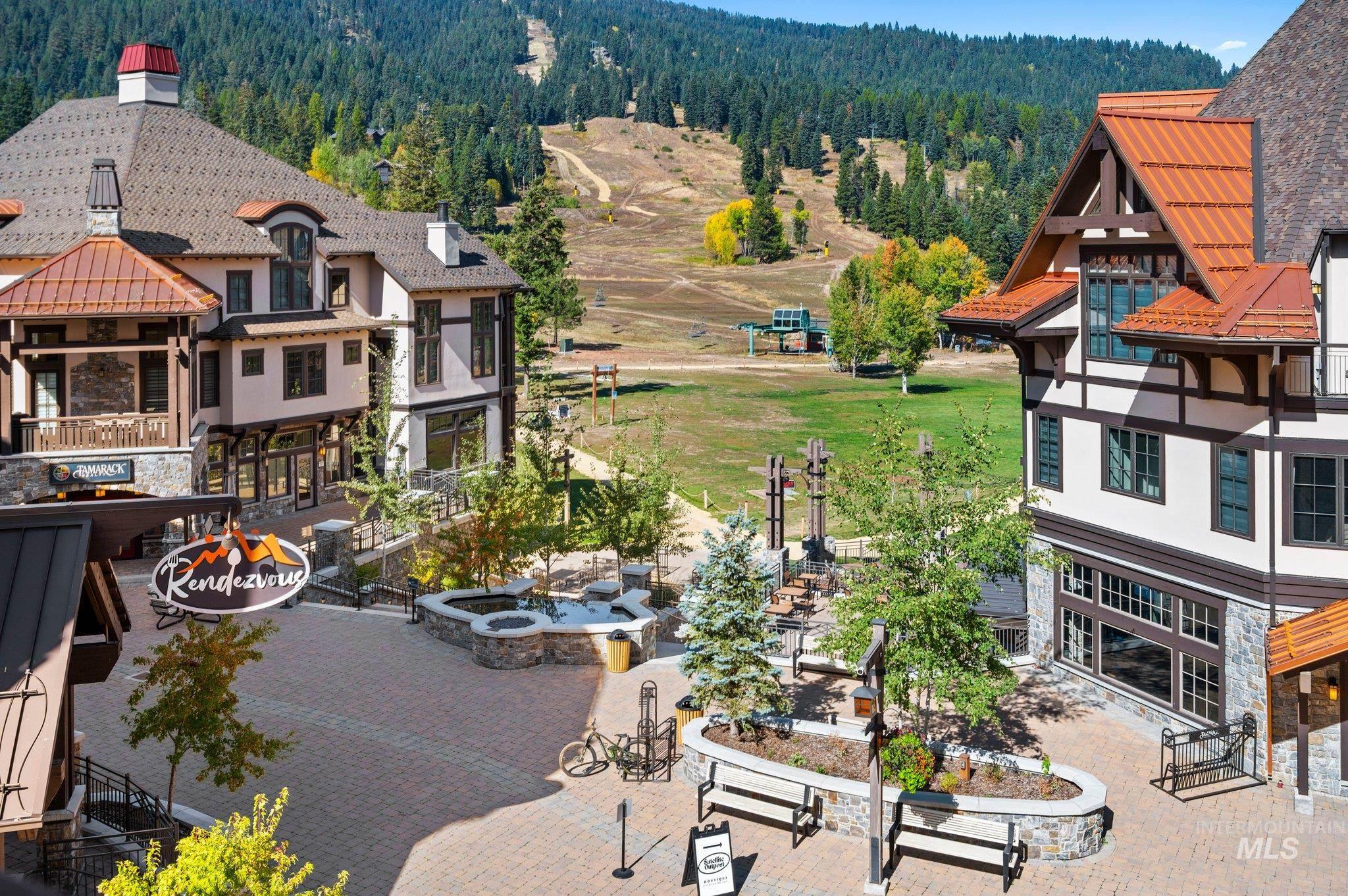 Mountain resort village featuring a paver courtyard with built-in stone planters